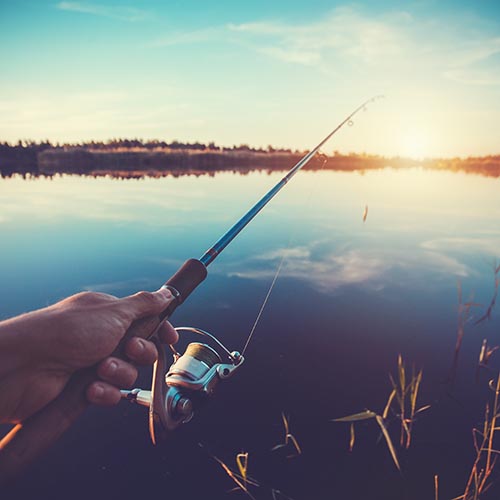 Fishing with rod on lake